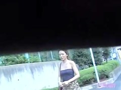 Sexy Asian with a thong got her skirt sharked while walking