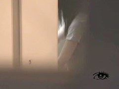 Kinky Japanese babe masturbates solo in voyeur video