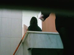 Asian girl and her cell phone in this toilet spy cam video