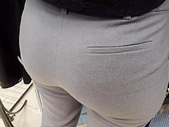 Delicious juicy butts saleswoman in very tight dress pants
