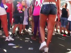 Candid voyeur scene with brunette in tiny top at a festival