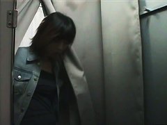 An asian cutie gets onto the changing room unaware of the hidden camera