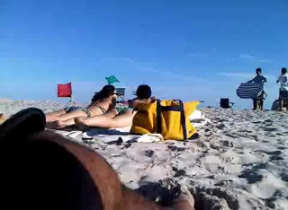 The leggy girl showed quick flash on voyeur beach cam
