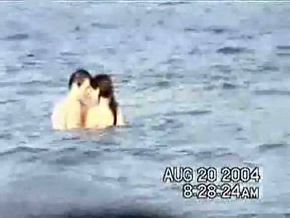 Sassy couple voyeured in the water seems to be fucking