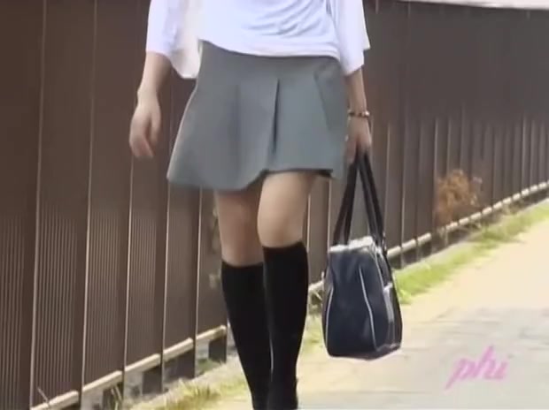 Young confused Asian sweetie loses her skirt during instant sharking attack