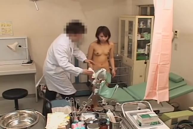 Petite babe getting an orgasm at a gynecologist exam image