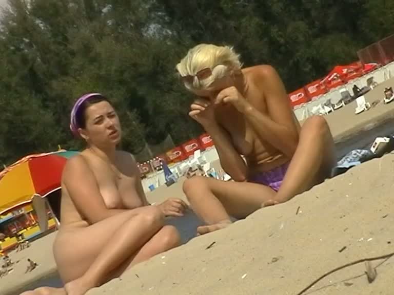 Big breasted woman sunbathing in a hidden camera